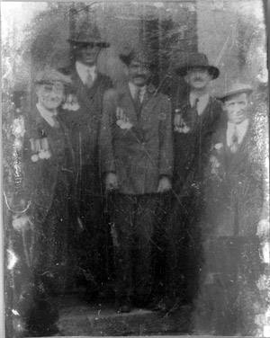 Ned is the second man from the left. All these veterans are wearing their medals.