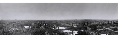 Passchendaele, Autumn 1917, Canadian soldiers are carrying duckboards across a desolate wilderness of waterfilled shell craters.